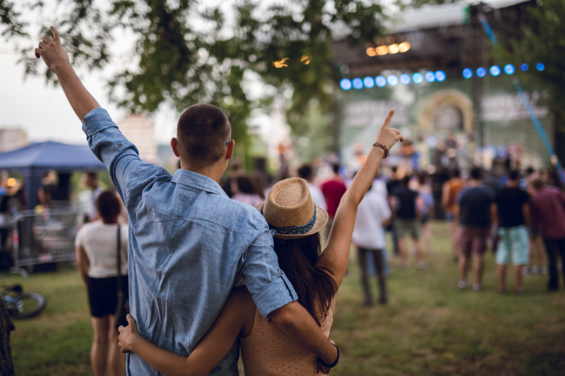 young couple watching concert